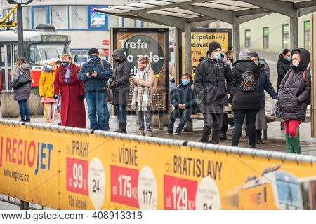 Brno, Czech Republic. 02-17-2021. People With Face Mask To Protect From Corona Virus Walk On Halvni 