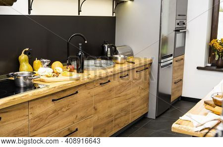 Oak Kitchen Worktop On Kitchen With A Sink, Cookstove And Food Ingredients, Bottle And Kitchen Facil