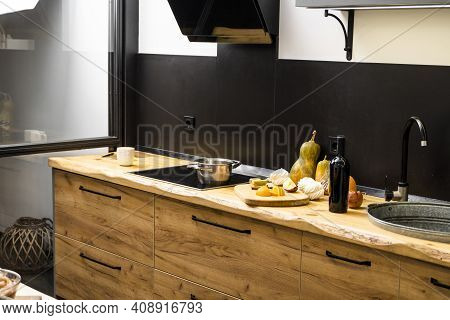Oak Kitchen Worktop On Kitchen With A Sink, Cookstove And Food Ingredients, Bottle And Kitchen Facil