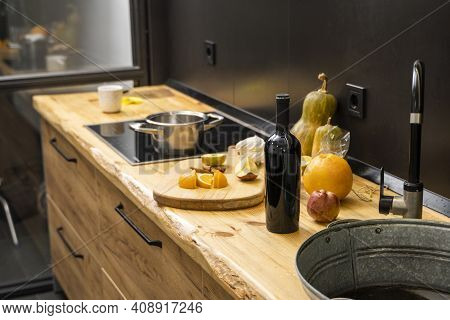 Oak Kitchen Worktop On Kitchen With A Sink, Cookstove And Food Ingredients, Bottle And Kitchen Facil
