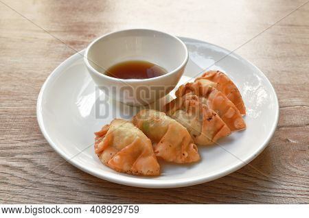 Crispy Fried Gyoza Or Japanese Dumpling Stuffed Mashed Pork Dipping Shoyu Sauce On Plate