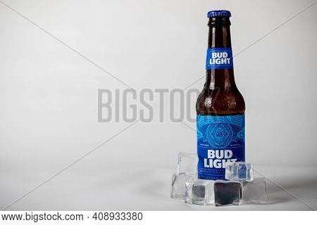 Sandhurst, United Kingdom; February 13th 2021:- A Cold Bottle Of Bud Light With Ice Cubes, Isolated 