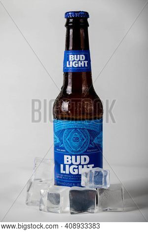 Sandhurst, United Kingdom; February 13th 2021:- A Cold Bottle Of Bud Light With Ice Cubes, Isolated 