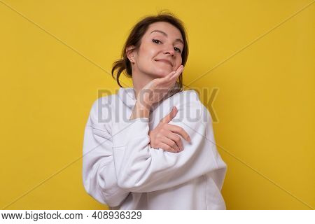 Woman Closing Eyes In Enjoyment, Hugging Herself, Feeling Comfortable And Cozy, Embracing Herself