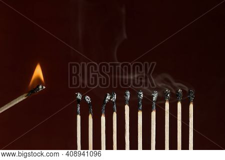 Burn Out Matches In A Row With One Lit Match Next As A Cause Of Ignition. Concept Of Ignition And Bu
