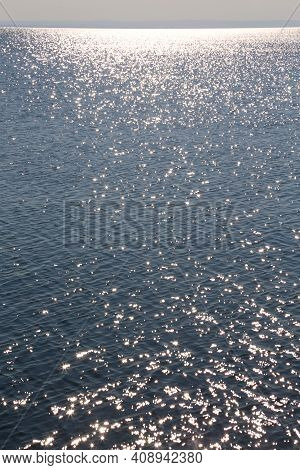 Panorama Of Lake Balaton Hungary Silvery Glittering Water With View Of Far Mountains Range And White