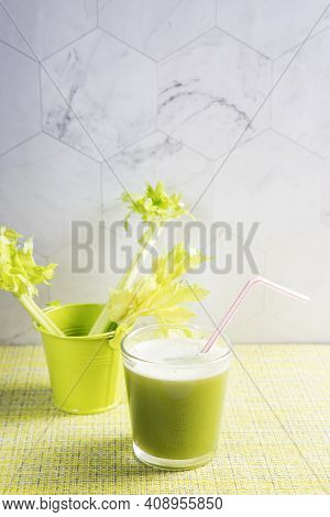Vegetable Juice From Celery In A Glass On A Light Background.