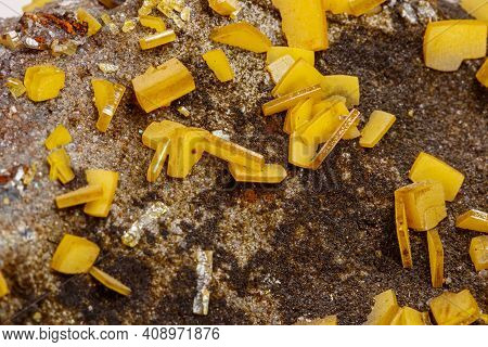 Macro Mineral Stone Yellow Wulfenite On A White Background