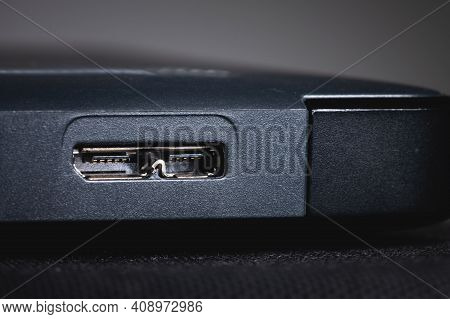 Gray External Hard Drive With Usb 3.0 Micro-b Port. Close-up Of The Port