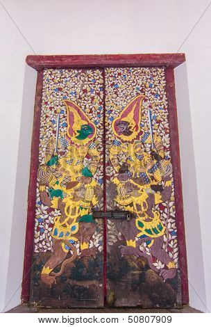 Ancient Buddhist Temple Mural Detail Depicting Thai Characters On The Door