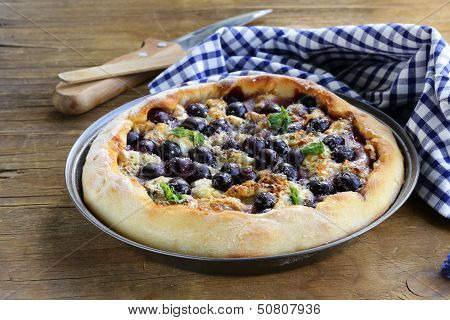homemade pie  (galette) with grapes and blue cheese