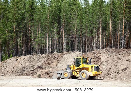 Yellow Tractor In Sandpit