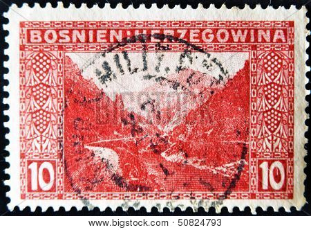 Stamp printed in Bosnia shows mountains rivers and road