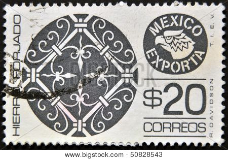 A stamp printed in Mexico shows filigree ironwork with the words Hierro Forjado