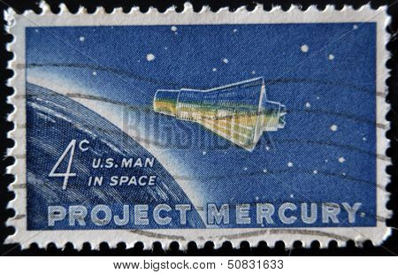 a stamp printed in USA shows Project Mercury Friendship 7 capsule and Globe