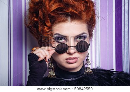 Girl Looking Over Her Glasses