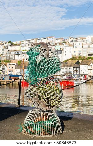 Fishing nets by water at harbourside in English fishing town of Brixham Devon