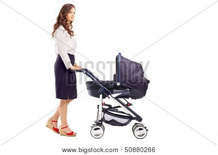 Full length portrait of a mother pushing a baby stroller, isolated on white background