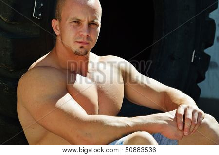 Athletic strong bodybuilder, execute exercise training in sport gym hall