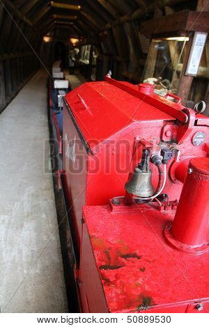 SCHWAZ, AUSTRIA - MARCH 24 : A red mine train that takes tourists 800 meters into the tunnel at the Silver Mine (Silberbergwerk) on March 24, 2013. It is the biggest silver mine of the Middle Ages