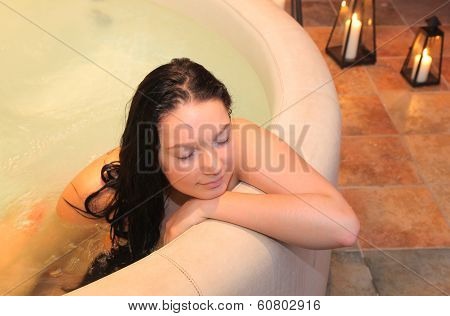 Pretty girl in the small jacuzzi