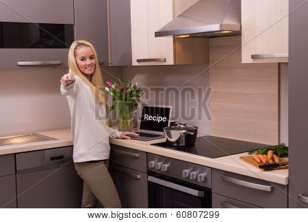 Woman in modern kitchen.