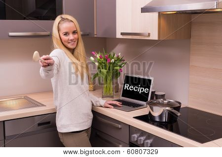 Woman in modern kitchen.