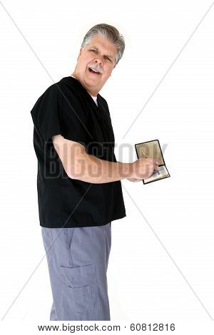 Medical Doctor Writing A Prescription With A Questioning Look