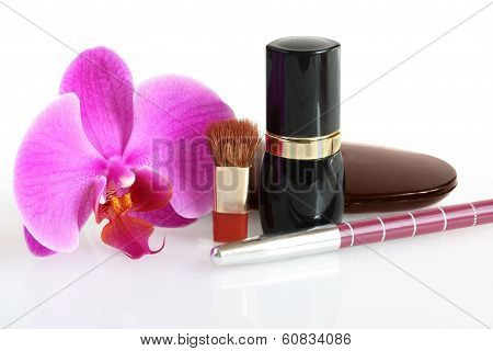 Cosmetics and an orchid