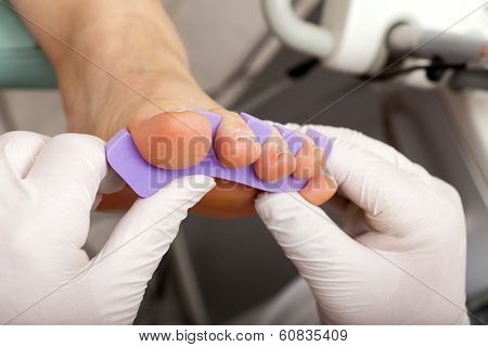 Toe Divider At The Foot Of A Woman