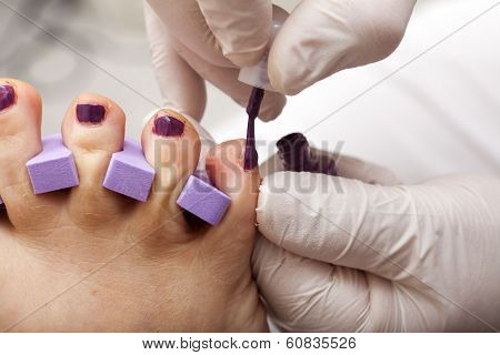 Toenails Are Painted In Fuchsia Color