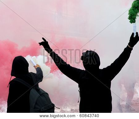 Two Protesters After A Soccer Match With The Smoke
