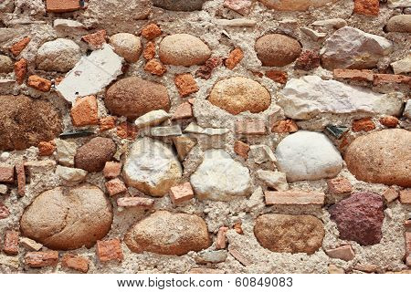 Un-structered Wall With Rocks Tiles And Cement