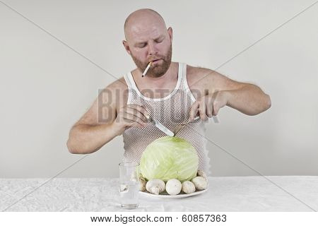 Smoking man eat cabbage and mushrooms