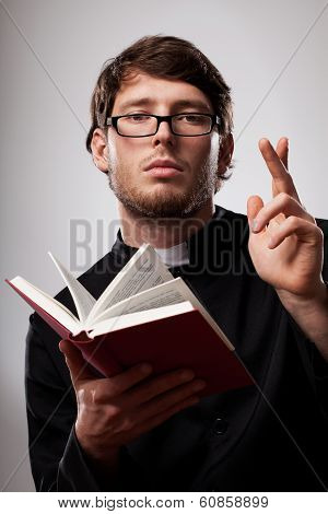 Priest With Holy Bible