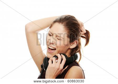 Young caucasian woman with headphones on her nack