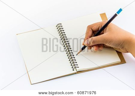 Hand writing with pencil on notebook