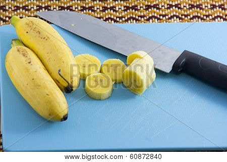 Fresh bananas on a cutting board
