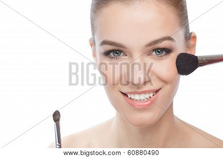 Young Woman And Make-up Brushes