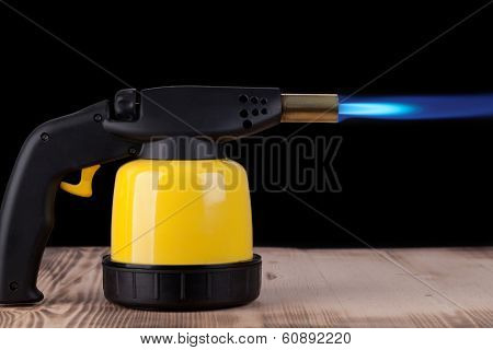 manual gas burner on a wooden background