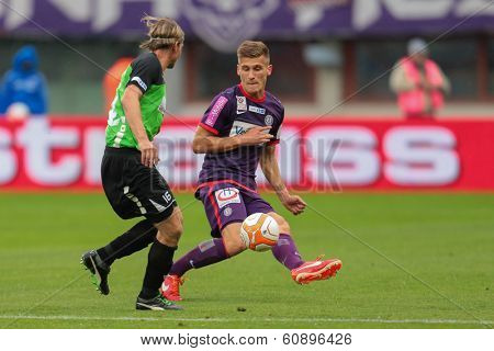 VIENNA,  AUSTRIA - MAY 30 Emir Dilaver (#27 Austria) and Thomas Krammer (#16 Pasching) fight for the ball during the Austrian cup final game on May 30, 2013 in Vienna, Austria.