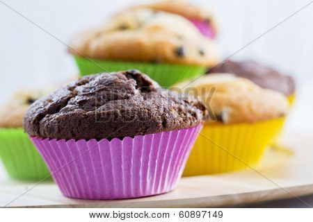 Muffins - homemade cupcakes in colorful molds