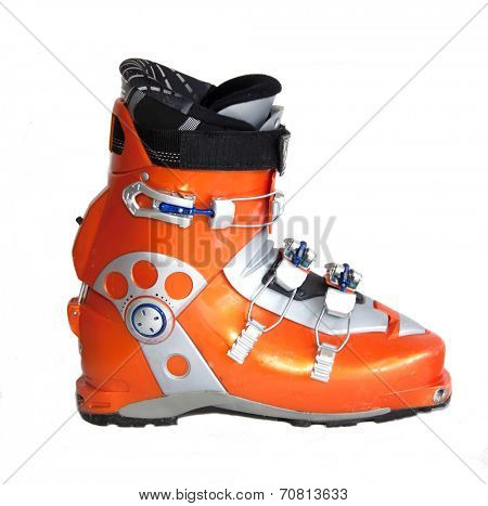 Modern orange ski boots isolated on white background