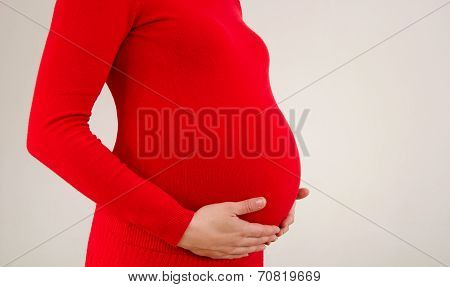 Close up on pregnant belly.