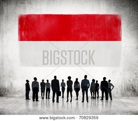 Silhouettes of Business People Looking at the Indonesian Flag