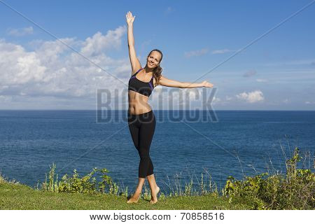 Beautiful Girl Stands With Arms Outstretched