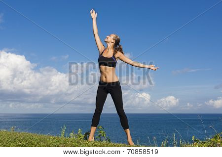 Beautiful Girl Stands With Arms Outstretched