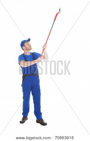Servant Cleaning Ceiling Over White Background
