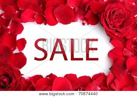 Concept of discount. Beautiful petals of red roses