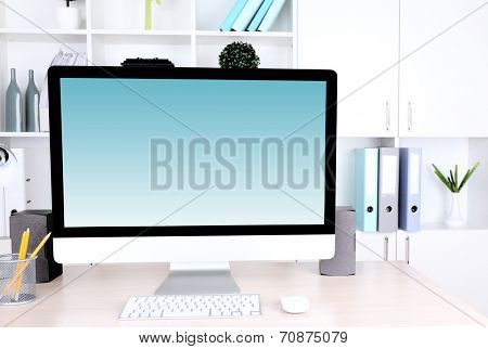 Computer with screensaver on table
